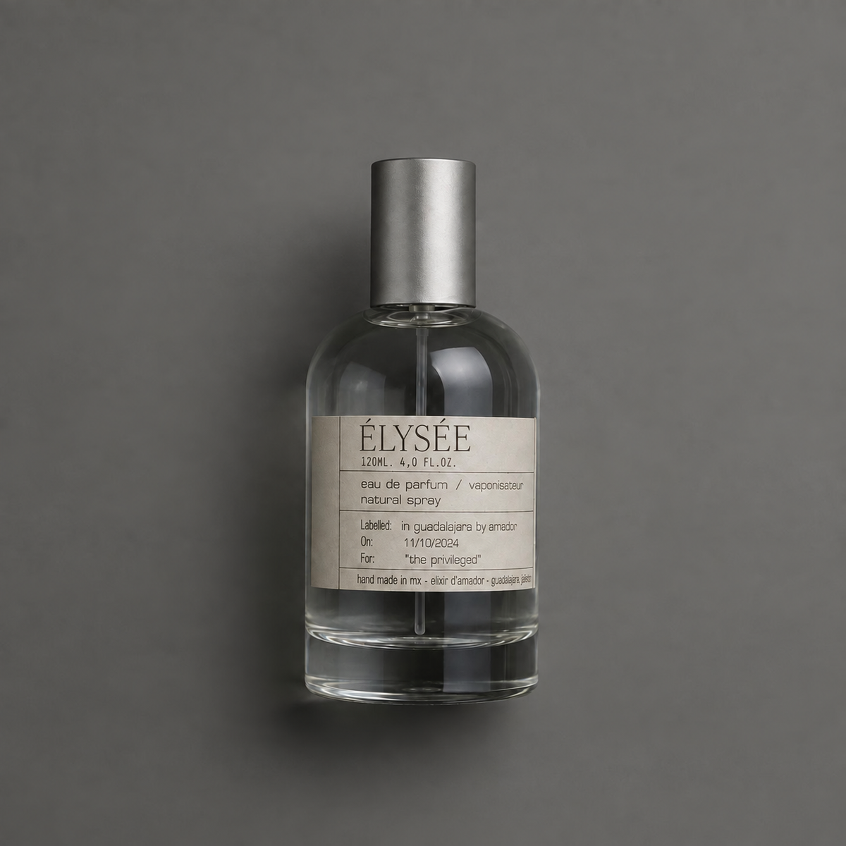Élysée de Elixir Amador: frasco cilíndrico de 120 ml sobre fondo gris.