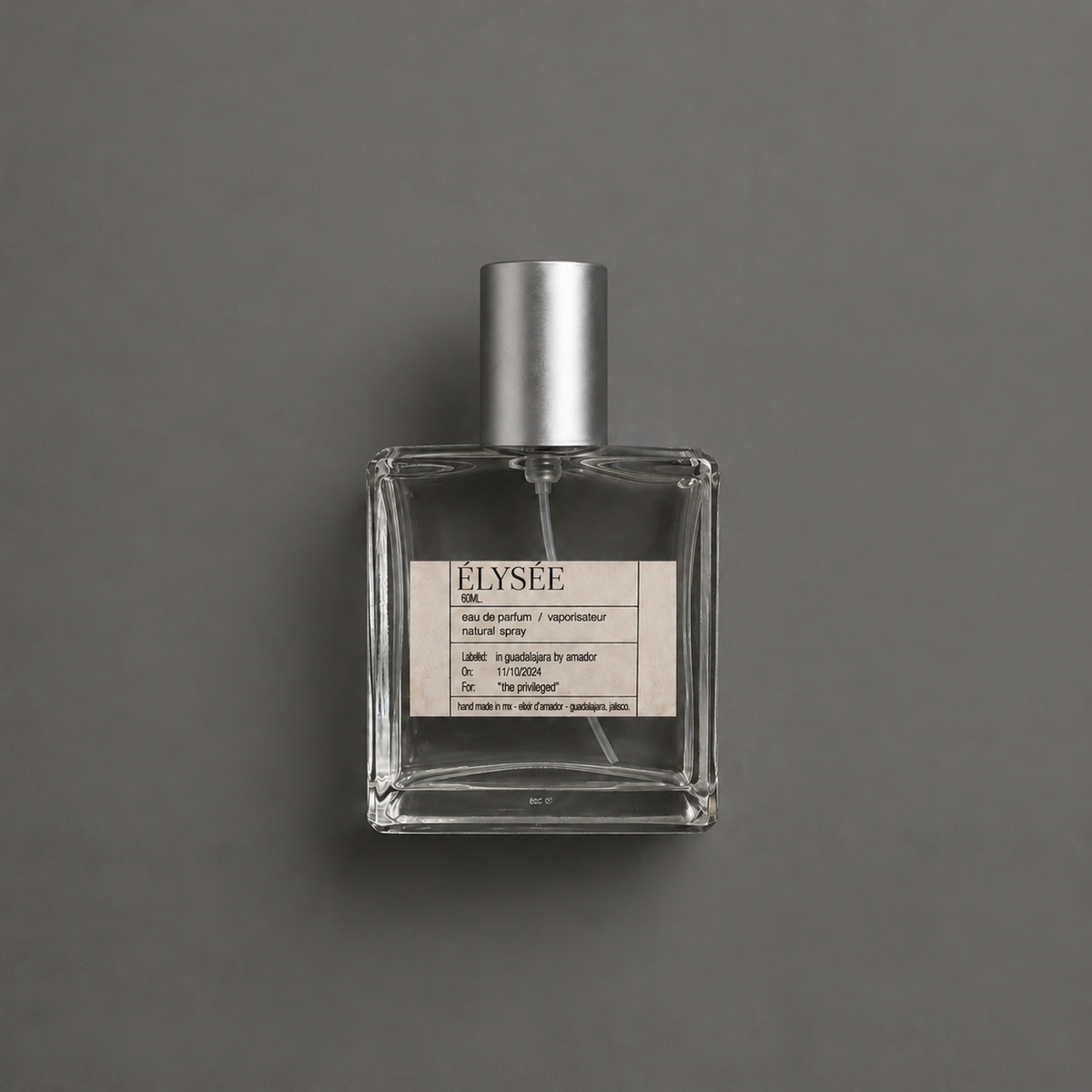 Élysée de Elixir Amador: frasco cuadrado de 60 ml sobre fondo gris.