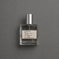Inédit de Elixir Amador: frasco cuadrado de 60 ml sobre fondo gris.