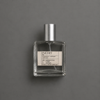 Inédit de Elixir Amador: frasco cuadrado de 60 ml sobre fondo gris.