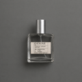 Phérome de Elixir Amador: frasco cuadrado de 60 ml sobre fondo gris.