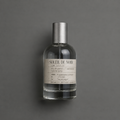 Soleil de Noir de Elixir Amador: frasco cilíndrico de 120 ml sobre fondo gris.